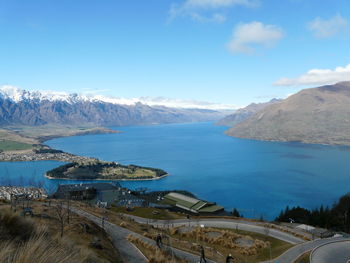 Scenic view of lake wakatipu by mountains against sky