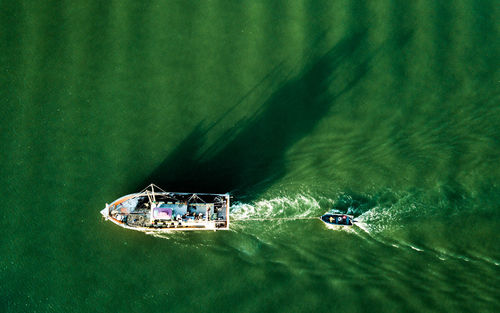 High angle view of people on boat in sea