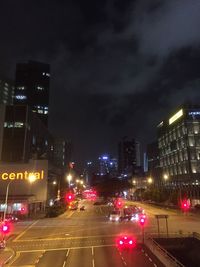 Vehicles on road in city at night