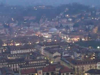 High angle view of illuminated cityscape against sky