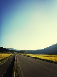 Empty country road along landscape