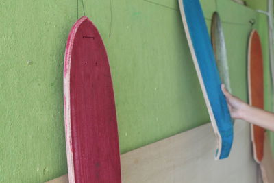 View of skateboards hanging in workshop