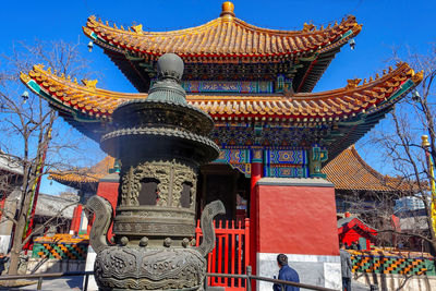 Low angle view of temple against building