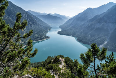Scenic view of lake and mountains against sky