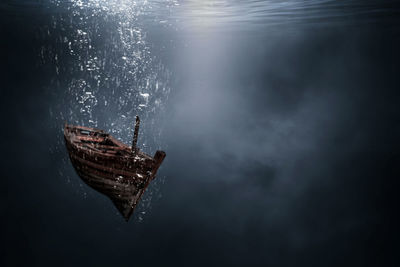 Boat sinking in sea