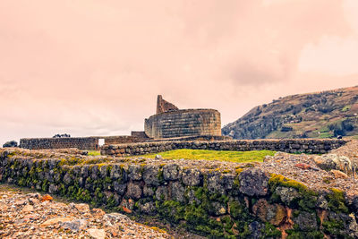 View of historical building against cloudy sky