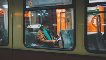 MAN SITTING IN BUS