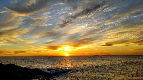 Scenic view of sea at sunset