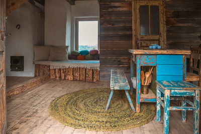 Empty chairs and table in building