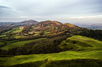 Scenic view of green landscape against sky