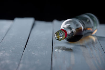 Close-up of glass bottle on table