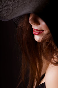 Close-up of woman wearing hat