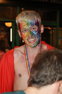 Portrait of man with multi colored mask
