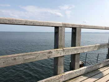 Pier over sea against sky