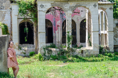 Woman in front of building