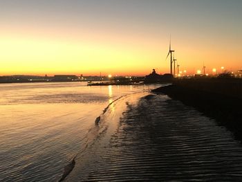 Scenic view of sea against clear sky during sunset