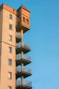 Low angle view of building against clear blue sky