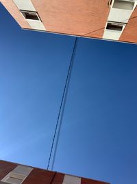 Low angle view of building against blue sky