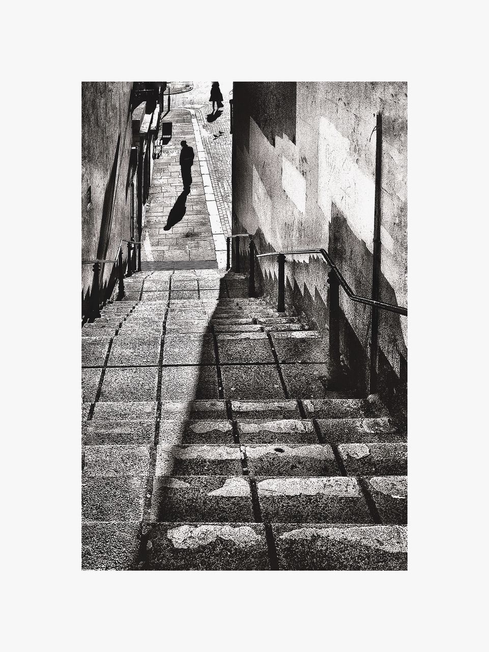 SHADOW OF PERSON WALKING ON STAIRCASE