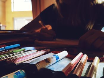 Close-up of multi colored pencils on table