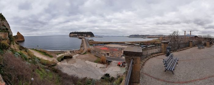 High angle view of beach and buildings against sky