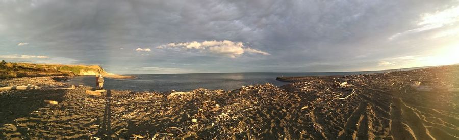 Scenic view of sea against sky at sunset