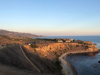 Scenic view of sea against clear sky during sunset