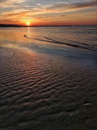 Scenic view of beach during sunset