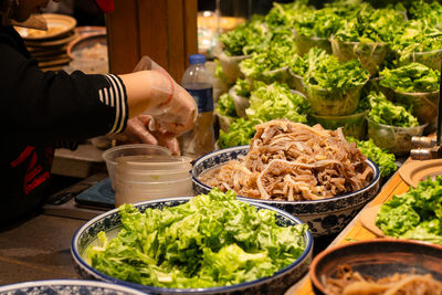 Midsection of man preparing food