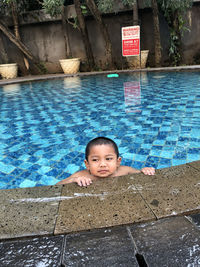 Portrait of boy in swimming pool