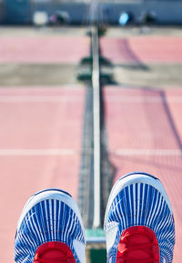 Close-up of tennis shoes against blurred background