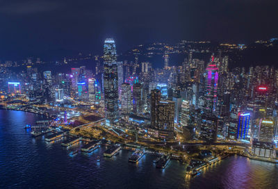 Aerial view of illuminated buildings in city at night