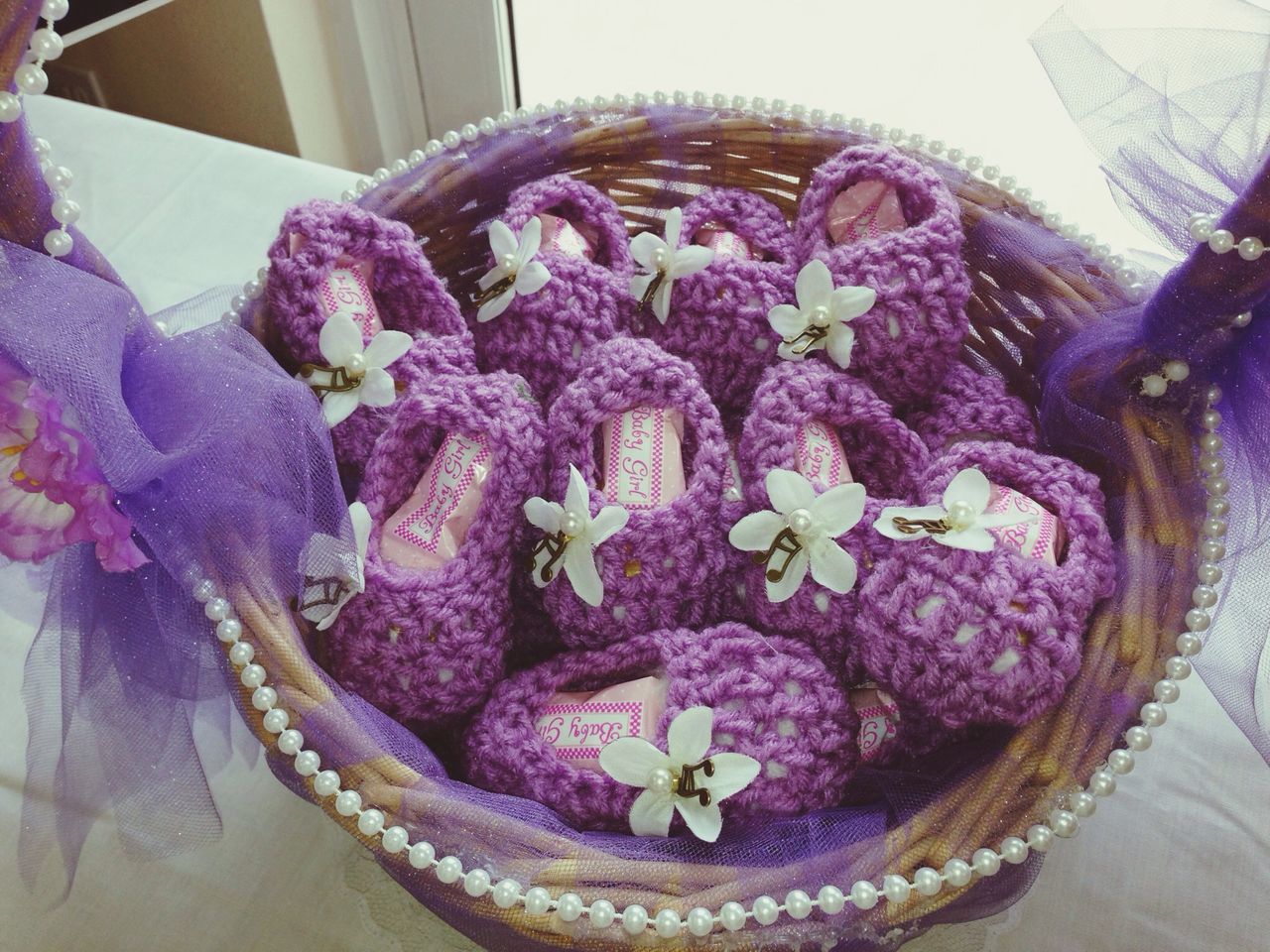 indoors, flower, freshness, decoration, still life, table, close-up, high angle view, multi colored, vase, home interior, fragility, no people, variation, purple, pink color, bouquet, petal, flower arrangement, basket