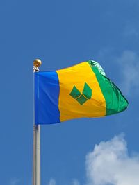 Low angle view of flag against blue sky