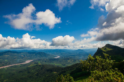 Scenic view of landscape against cloudy sky