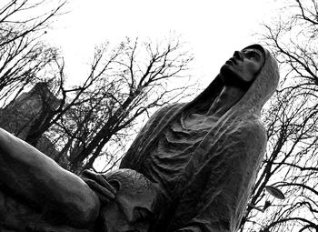 Low angle view of statue against sky