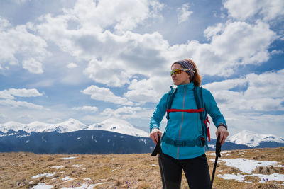 Full length of man standing against mountain