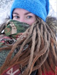 Portrait of woman with dreadlocks during winter