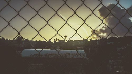 Chainlink fence at sunset