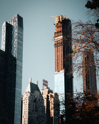 Low angle view of buildings in city against sky