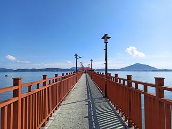 Pier over sea against sky