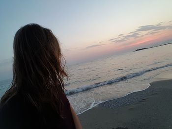 Rear view of woman on beach