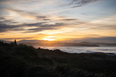 Scenic view of sea against sky during sunset