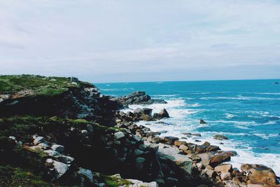 Scenic view of sea against cloudy sky