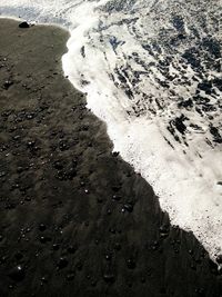 High angle view of waves on beach