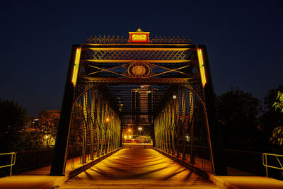 Illuminated bridge against sky