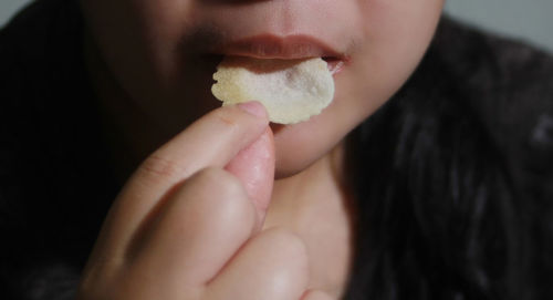 Close-up of woman eating food