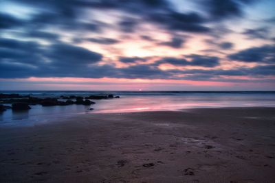 Scenic view of sea against dramatic sky