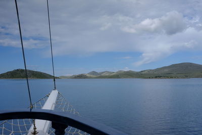 Sailboat in sea against sky