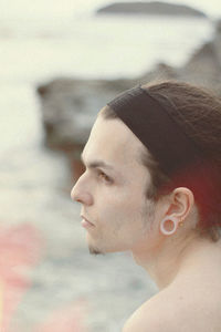 Portrait of young man looking away